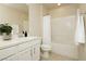 Bathroom with a vanity, shower-tub combo, and white fixtures at 6730 Pivot Point St, Las Vegas, NV 89148