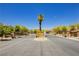 Gated community entrance with decorative brick pillars, secure access, and a meticulously maintained landscape at 6730 Pivot Point St, Las Vegas, NV 89148