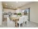 Dining area with a sliding door that leads to a backyard and an open concept kitchen at 6730 Pivot Point St, Las Vegas, NV 89148