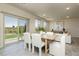 Dining room features a dining table with chairs, a sliding glass door and backyard view at 6730 Pivot Point St, Las Vegas, NV 89148