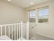 Bright hallway features neutral paint, carpet, and windows overlooking the neighborhood at 6730 Pivot Point St, Las Vegas, NV 89148
