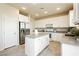 Well-lit kitchen boasts stainless steel appliances and ample cabinet space at 6730 Pivot Point St, Las Vegas, NV 89148