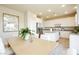 Bright kitchen features white cabinets, stainless appliances, and an island at 6730 Pivot Point St, Las Vegas, NV 89148