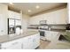 Spacious kitchen with stainless appliances and an island for extra counter space at 6730 Pivot Point St, Las Vegas, NV 89148