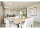 Bright living room features a dining table and an open concept floor plan at 6730 Pivot Point St, Las Vegas, NV 89148