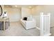 Cozy second-floor living room featuring a white sofa, neutral paint, and soft carpet at 6730 Pivot Point St, Las Vegas, NV 89148