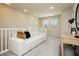 Second-floor living room with modern furniture and neighborhood views at 6730 Pivot Point St, Las Vegas, NV 89148