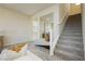 Bright living room features an adjacent staircase with neutral colored carpet steps at 6730 Pivot Point St, Las Vegas, NV 89148