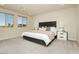 Spacious main bedroom with plush carpet, modern furniture, and large windows at 6730 Pivot Point St, Las Vegas, NV 89148