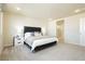 Spacious main bedroom with plush carpet, modern furniture, and ensuite bathroom at 6730 Pivot Point St, Las Vegas, NV 89148