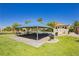 Community picnic area offers shaded seating and a grill area in a park-like setting at 6730 Pivot Point St, Las Vegas, NV 89148