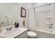 Bathroom featuring shower/tub combination, vanity, framed art and ceramic tile flooring at 6938 Feather Hill St, North Las Vegas, NV 89086