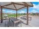 Outdoor picnic area with shaded pavilion, tables, benches, and grill for community gatherings at 6938 Feather Hill St, North Las Vegas, NV 89086