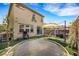 Expansive backyard showcasing artificial turf, trampoline, grill, covered seating and outdoor entertaining space at 7011 Toll Mountain St, North Las Vegas, NV 89086