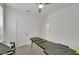 Spare bedroom has modern carpet, neutral paint, and a ceiling fan at 7011 Toll Mountain St, North Las Vegas, NV 89086