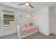 Bright bedroom with a window and built-in bed with storage drawers at 7011 Toll Mountain St, North Las Vegas, NV 89086