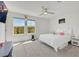 A bright bedroom features two windows offering ample natural light and plush carpeting for added comfort at 7011 Toll Mountain St, North Las Vegas, NV 89086