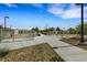 Fenced community dog park with gravel ground cover and walking path at 7011 Toll Mountain St, North Las Vegas, NV 89086
