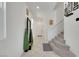Bright foyer showcasing staircase with neutral tile flooring and white walls at 7011 Toll Mountain St, North Las Vegas, NV 89086