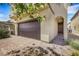 Home showing garage, front door, and brick paver driveway at 7011 Toll Mountain St, North Las Vegas, NV 89086