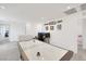 Open game room with air hockey table and fun decor at 7011 Toll Mountain St, North Las Vegas, NV 89086