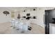 Open kitchen features stainless steel appliances, a large island and barstool seating at 7011 Toll Mountain St, North Las Vegas, NV 89086
