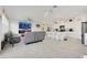 Spacious living room with tile flooring, modern lighting, and an open floor plan at 7011 Toll Mountain St, North Las Vegas, NV 89086