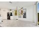 Bright living room with tile floors, pendant lighting, and neutral decor at 7011 Toll Mountain St, North Las Vegas, NV 89086