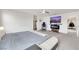Spacious main bedroom featuring plush carpeting, modern furnishings, and a cozy fireplace for added comfort at 7011 Toll Mountain St, North Las Vegas, NV 89086