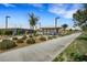 Community park with a shaded picnic area, walking paths and desert landscaping at 7011 Toll Mountain St, North Las Vegas, NV 89086