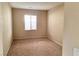 Neutral bedroom features beige carpet, a window with blinds, and neutral-colored walls at 7563 Captain Lord Ct, Las Vegas, NV 89166