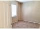 A bright bedroom with a window and neutral walls and flooring at 7563 Captain Lord Ct, Las Vegas, NV 89166