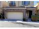 Two-story home with stone accents and a two-car garage at 7563 Captain Lord Ct, Las Vegas, NV 89166