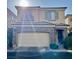 Two-story home with stone accents and a two-car garage at 7563 Captain Lord Ct, Las Vegas, NV 89166