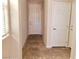 Hallway features tile flooring, neutral walls, and white doors with neutral trim at 7563 Captain Lord Ct, Las Vegas, NV 89166
