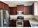Modern kitchen with stainless steel appliances and granite countertops at 7563 Captain Lord Ct, Las Vegas, NV 89166