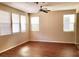 Spacious living room with multiple windows and hardwood floors at 7563 Captain Lord Ct, Las Vegas, NV 89166