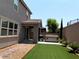 Exterior backyard showing artificial turf, patio, hot tub and privacy wall at 7861 Hamilton Pool Dr, Las Vegas, NV 89113