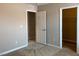 Bedroom featuring plush carpeting, base trim, and a neutral color palette at 7861 Hamilton Pool Dr, Las Vegas, NV 89113