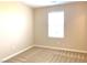 Bright bedroom featuring a large window and neutral-colored walls at 7861 Hamilton Pool Dr, Las Vegas, NV 89113