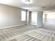Open bedroom space showing patterned carpet, natural light, and access to the landing at 7861 Hamilton Pool Dr, Las Vegas, NV 89113