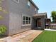 Home's exterior featuring a tiled roof, covered patio, and desert landscaping at 7861 Hamilton Pool Dr, Las Vegas, NV 89113
