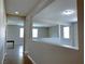 Interior hallway view showcasing an open floor plan with natural light and neutral color scheme at 7861 Hamilton Pool Dr, Las Vegas, NV 89113