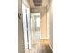Inviting hallway with neutral paint, leading to various rooms in the house at 7861 Hamilton Pool Dr, Las Vegas, NV 89113