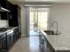 View from a kitchen island leading to the outdoor patio through sliding glass doors at 7861 Hamilton Pool Dr, Las Vegas, NV 89113