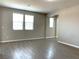 Spacious living room featuring hardwood floors and an open layout, perfect for relaxing at 7861 Hamilton Pool Dr, Las Vegas, NV 89113