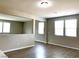 Bright living room with hardwood floors, multiple windows, and plenty of natural light at 7861 Hamilton Pool Dr, Las Vegas, NV 89113