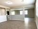Spacious living room with hardwood floors and an open layout, perfect for entertaining guests at 7861 Hamilton Pool Dr, Las Vegas, NV 89113