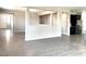 Open-concept living space featuring hardwood floors and seamless flow to the kitchen and entryway at 7861 Hamilton Pool Dr, Las Vegas, NV 89113