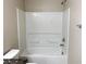 Bathroom featuring a shower-tub combo and sleek fixtures at 7861 Hamilton Pool Dr, Las Vegas, NV 89113